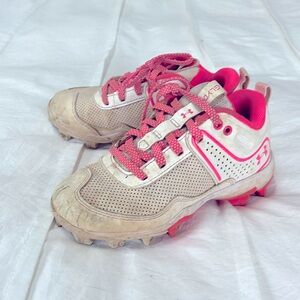 Under Armour girl softball cleats size 12.  Worn for 1 season.